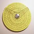 Pickett circular slide rule with two cursors. (4.25&nbsp;in/10.9&nbsp;cm width) Reverse has additional scale and one cursor.