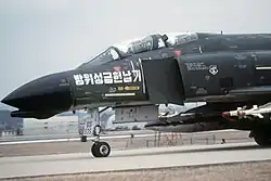 A Republic of Korea Air Force F-4D Phantom II armed with AIM-9 missiles at Daegu Air Base, 1979.