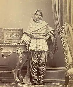 Portrait of a girl from Karachi, Sindh, in narrow Sindhi suthan and paro. c. 1870.