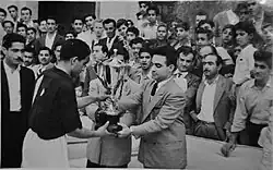 Al-Minaa captain Allawi receives the Hanna Al-Sheikh trophy after the team won the championship in 1951.