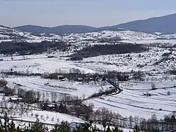 photo of this Village from afar in snow