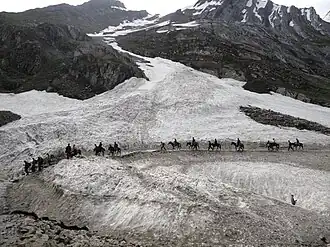 Pilgrims riding ponies on the way to the Amarnath Cave Temple